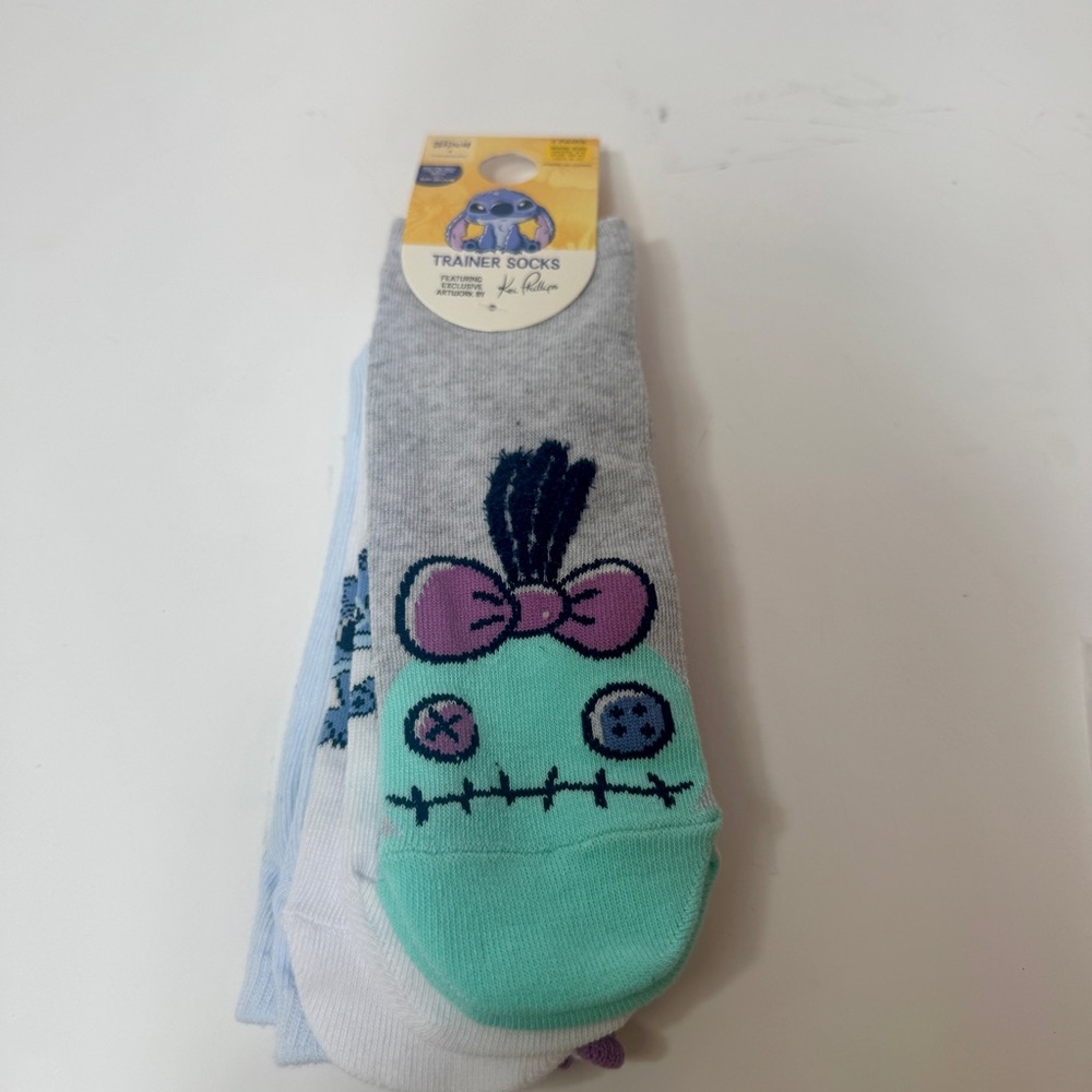 NWT. Disney stitch and Scrump three pairs of trainer socks. Size 8-10.